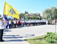 В честь праздника к подножию бронекатера «Ейский патриот» возложили цветы